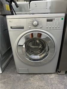PRE-OWNED LG VENTLESS 24" SILVER FRONT LOAD WASHER & DRYER COMBO UNIT