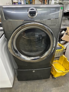 PRE-OWNED ELECTROLUX FRONT LOAD STEAM GAS DRYER ON  A PEDESTAL